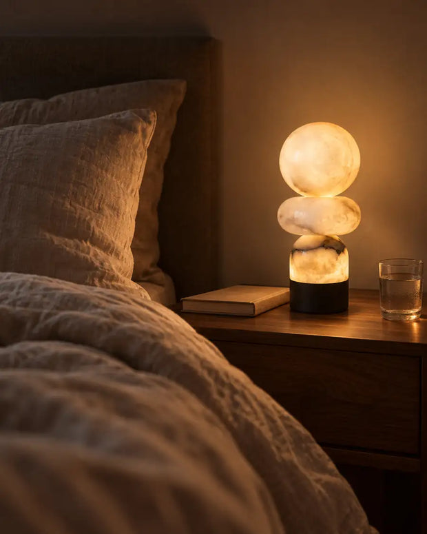 Sculptural alabaster bedside lamp creating warm bedroom lighting — AUVIELIGHT